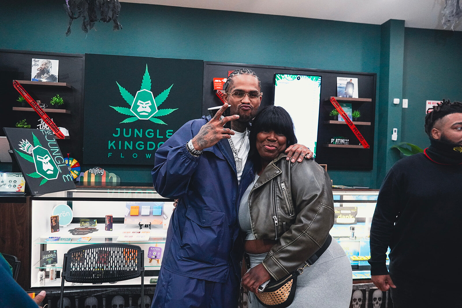 Customers shopping the counter at Jungle Kingdom Flower cannabis dispensary in Bed-Stuy, Brooklyn