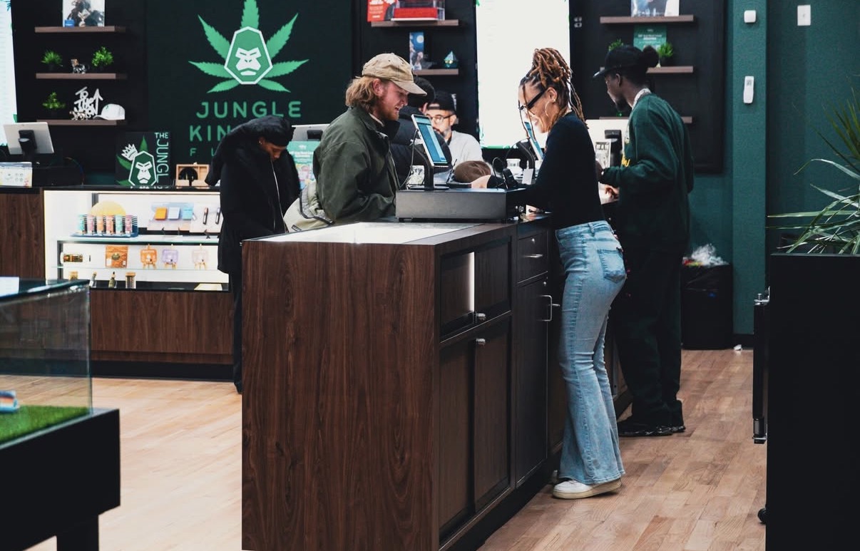 Customers shopping at Jungle Kingdom Flower cannabis dispensary in Bed-Stuy, Brooklyn